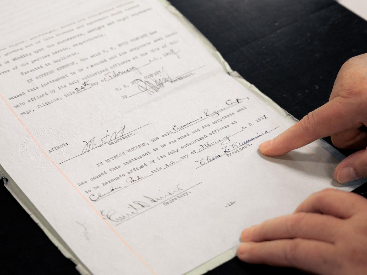 Lori displaying signatures on old paperwork