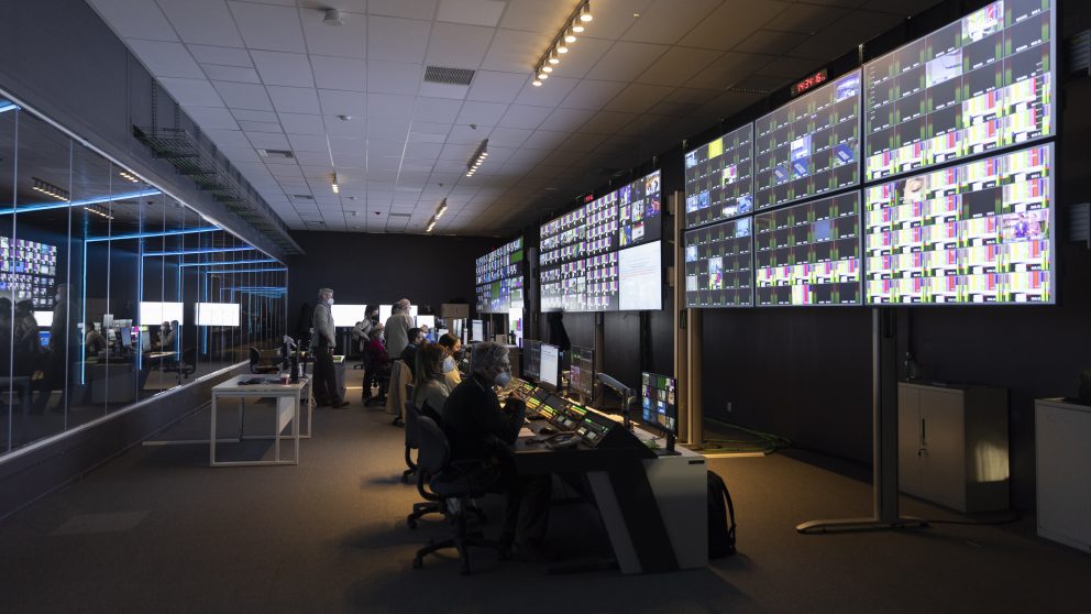Control room with computers and large monitors