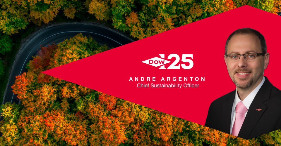 profile of Andre Argenton, Dow 125 logo "Andre Argenton chief sustainability officer" background of a road through fall foliage forest