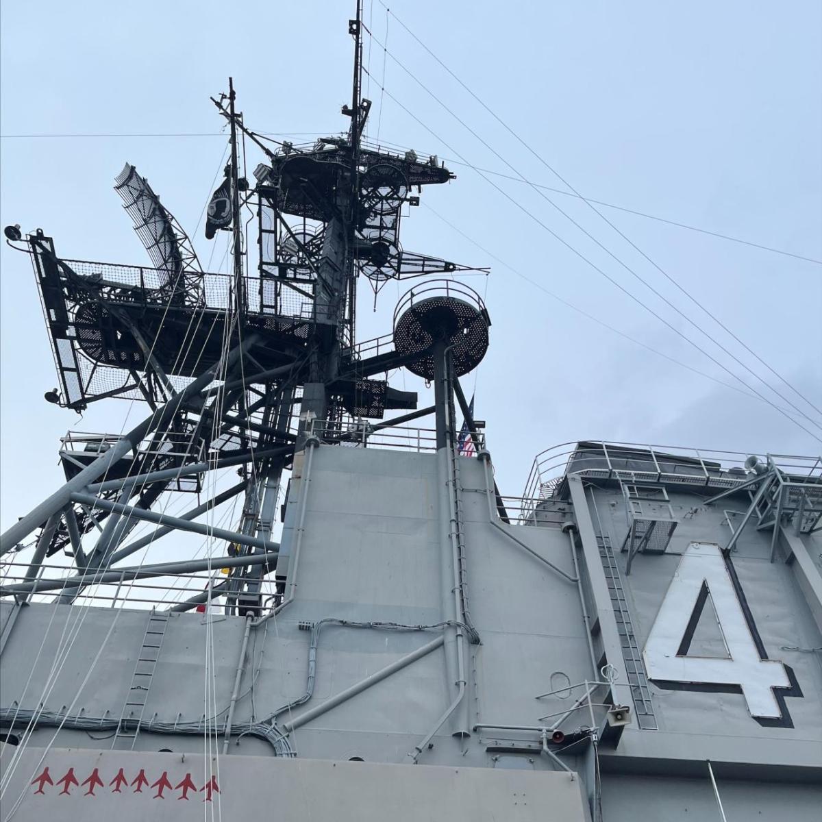 Looking up to a high part on a military ship.