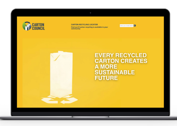 A laptop screen in yellow "Every recycled carton creates a more sustainable future".