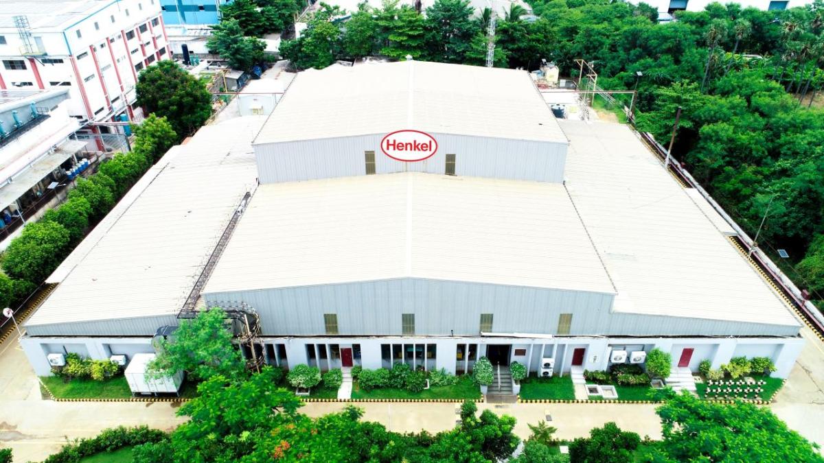 Aerial view of  a large building with Henkel sign.