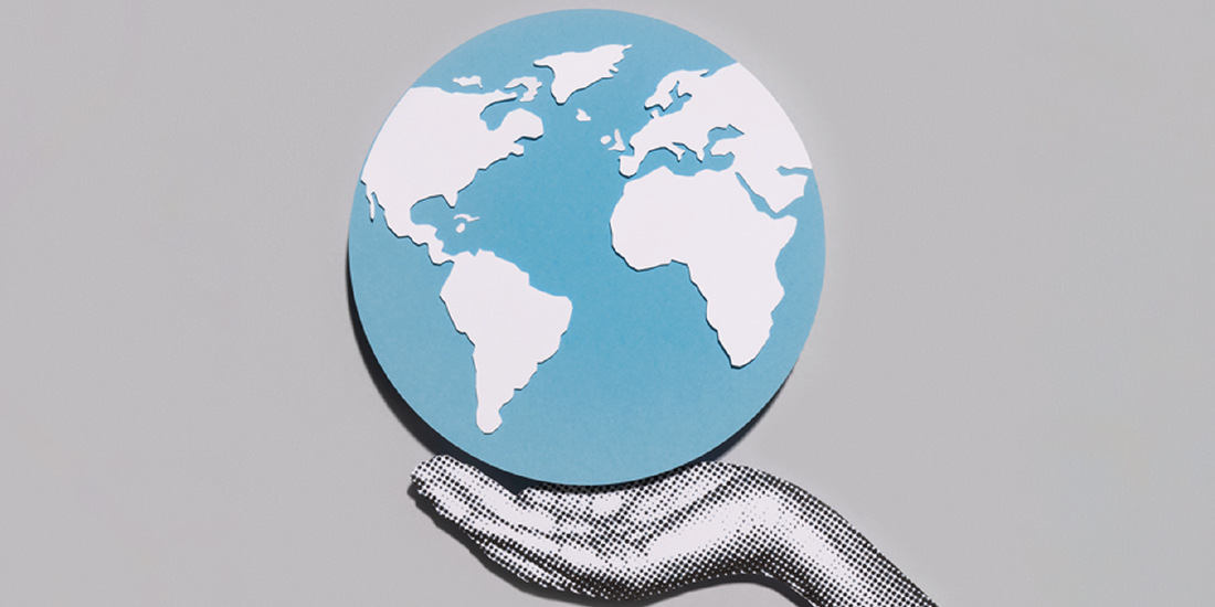 Hand holding a globe