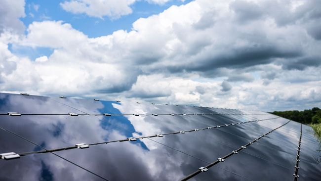 Clouds reflected in solar panels