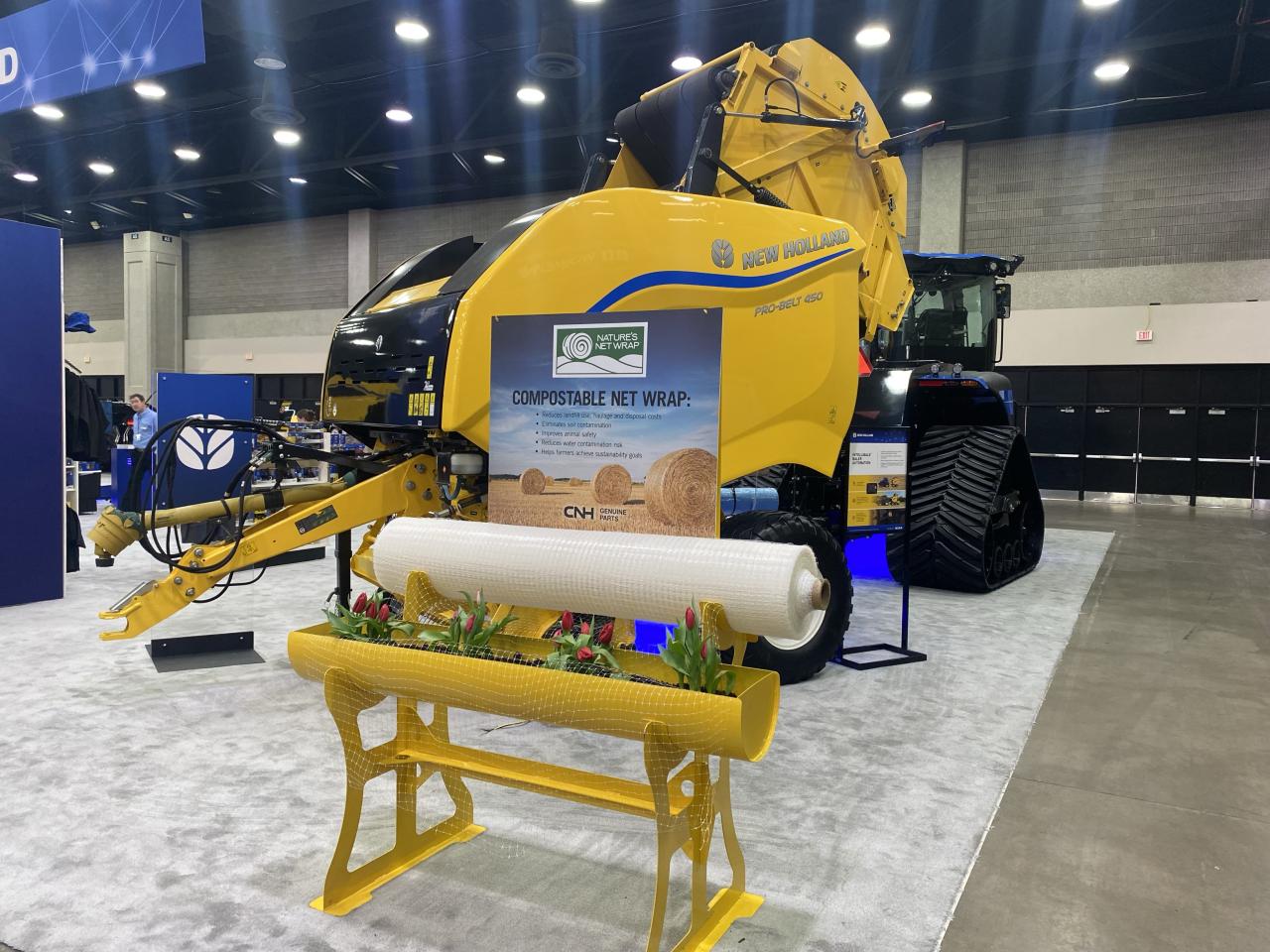 A roll of Nature's Net Wrap on display in front of a yellow machine