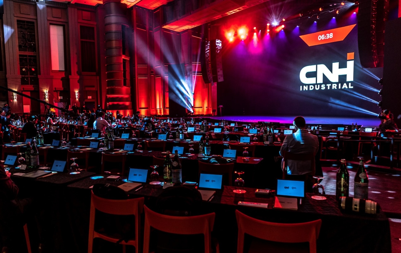 people sitting in auditorium with individual computers