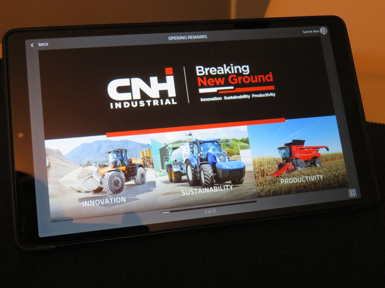 table reading "CNH Industrial Breaking New Ground" with images of tractors