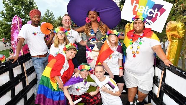 Group of LGBTQ community  members celebrating at Pride parade