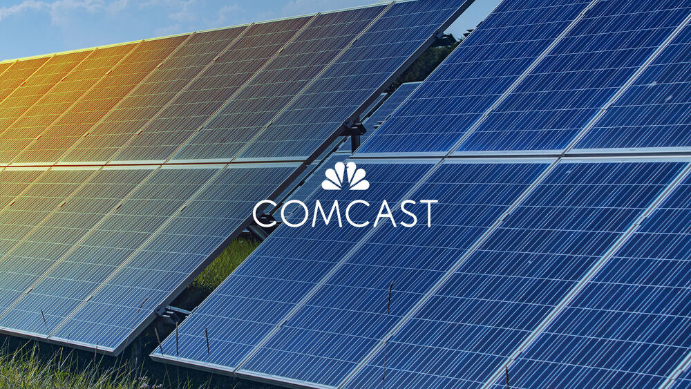 array of solar panels with Comcast logo