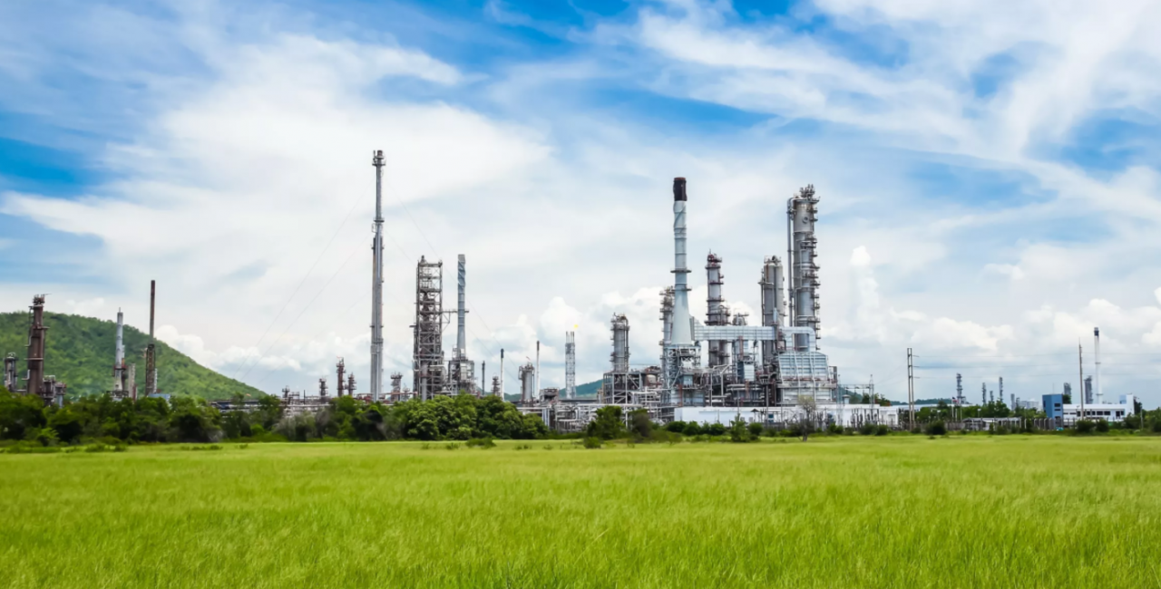 Skyline with power plant in field