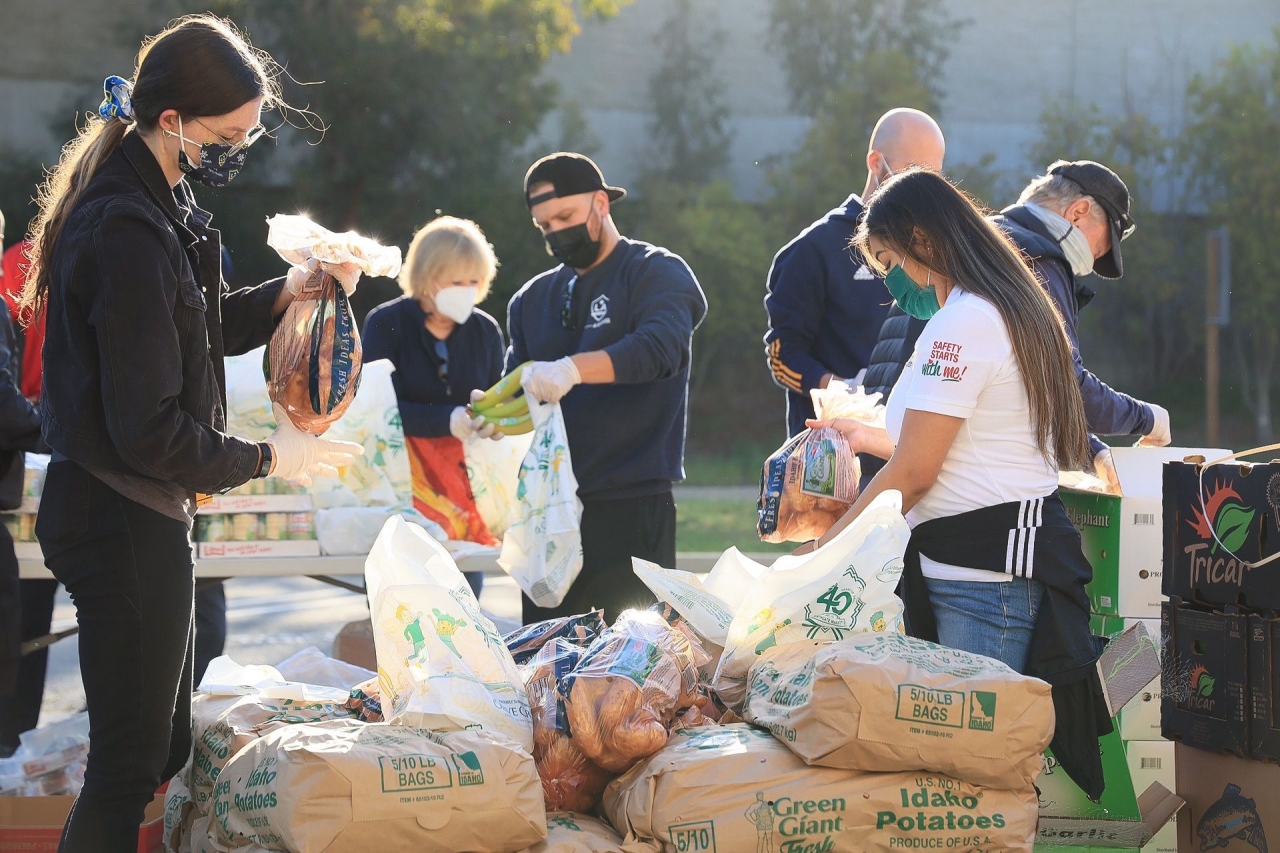 Volunteers assemble grocery bags to help vulnerable students at LA Harbor College's Spring Food Distribution event