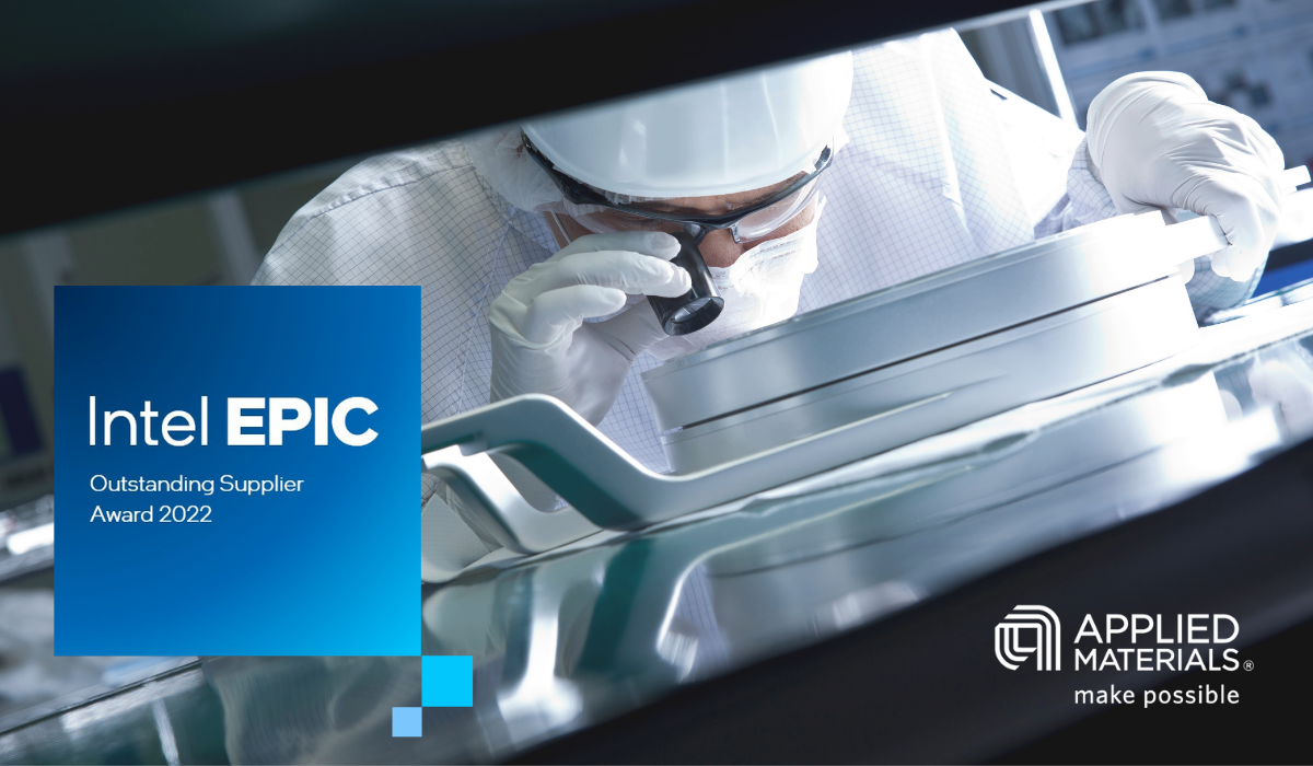 Person in protective outfit looks through an eyepiece at a piece of equipment. "Intel EPIC" and Applied materials logos on left and right of the image