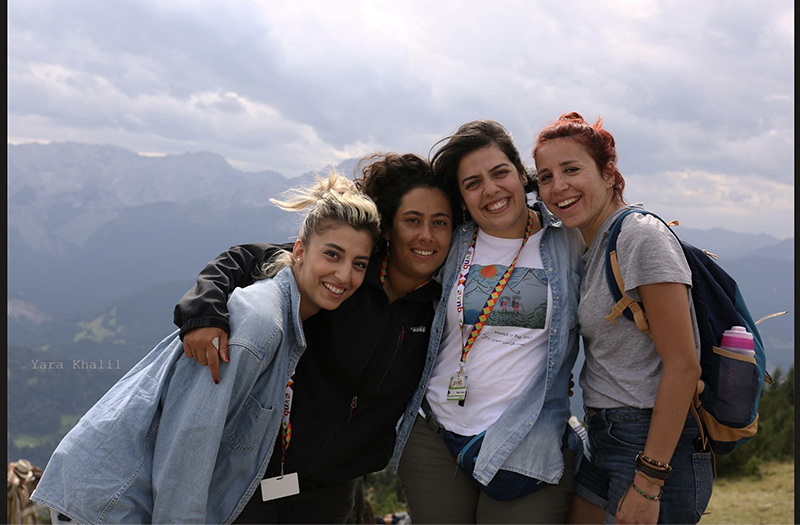 Four hikers posing together