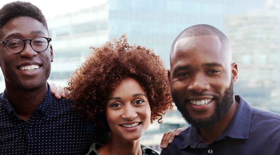 3 People standing together smiling