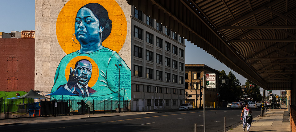 Mural of MLK Jr. on a Building next to an overpass