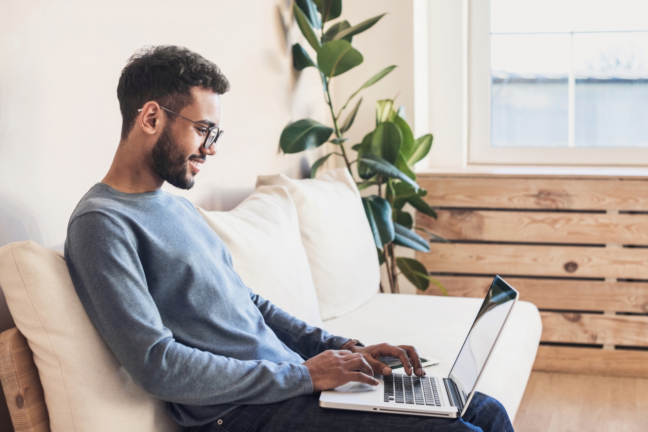 Young adult using a laptop