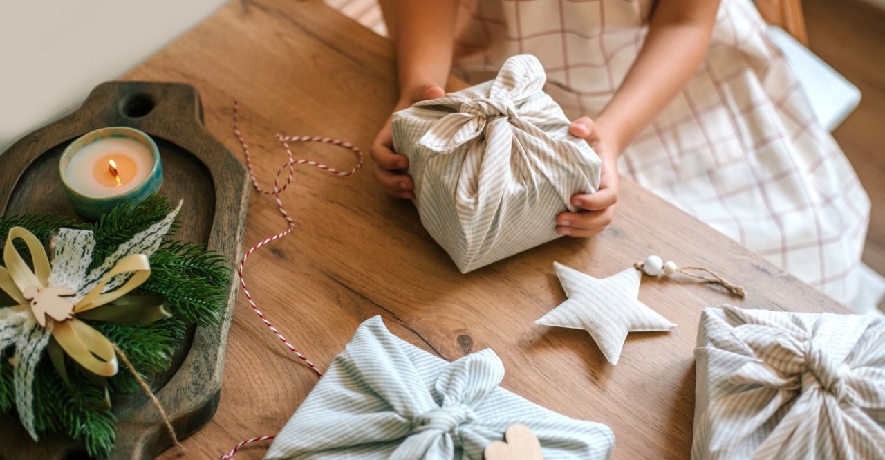 child wrapping gifts