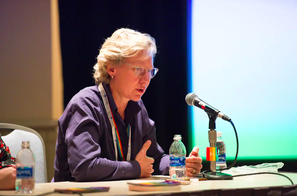 OUT & EQUAL WORKPLACE ADVOCATES Annette Friskopp speaking on the board of the Out & Equal Workplace Summit in 2017.