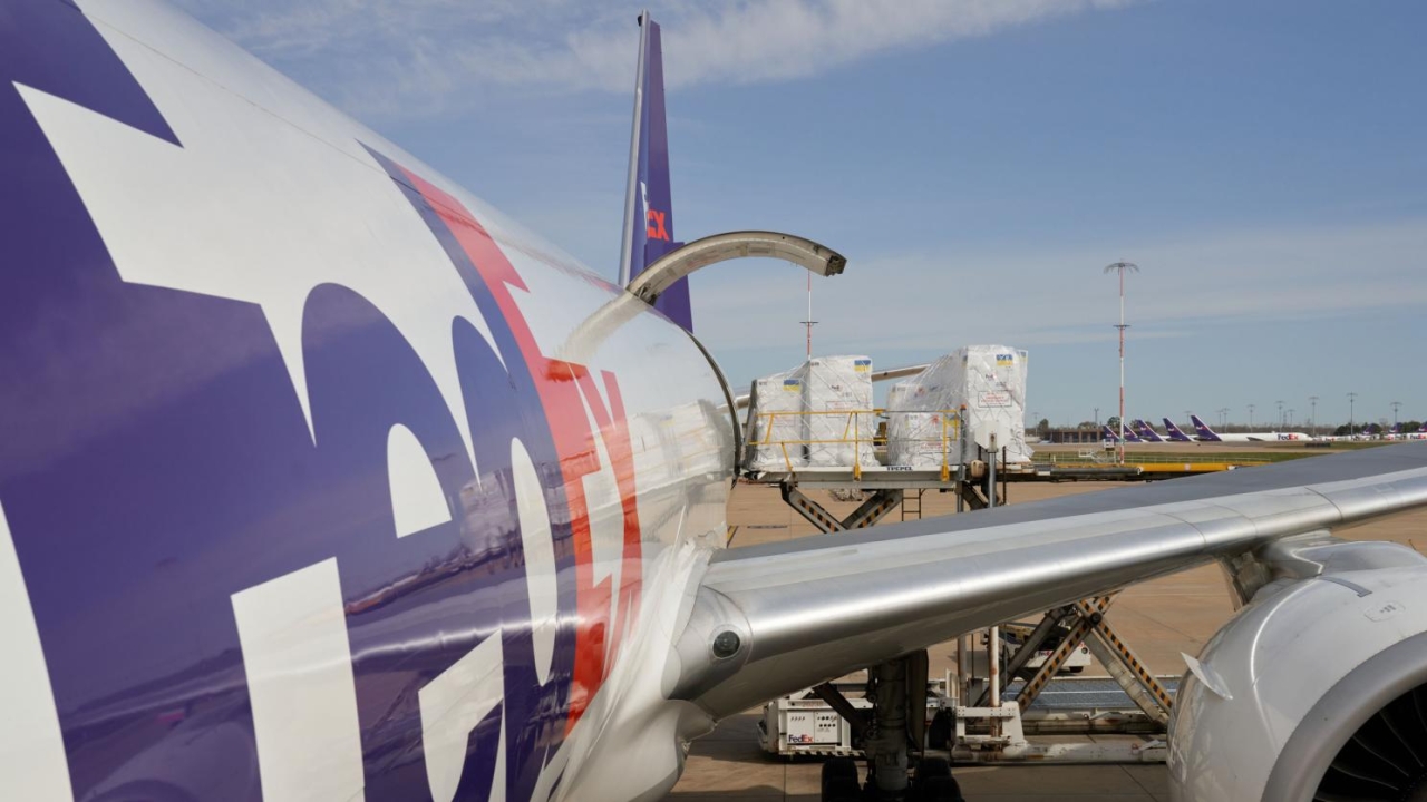 FedEx plane with cargo being loaded in