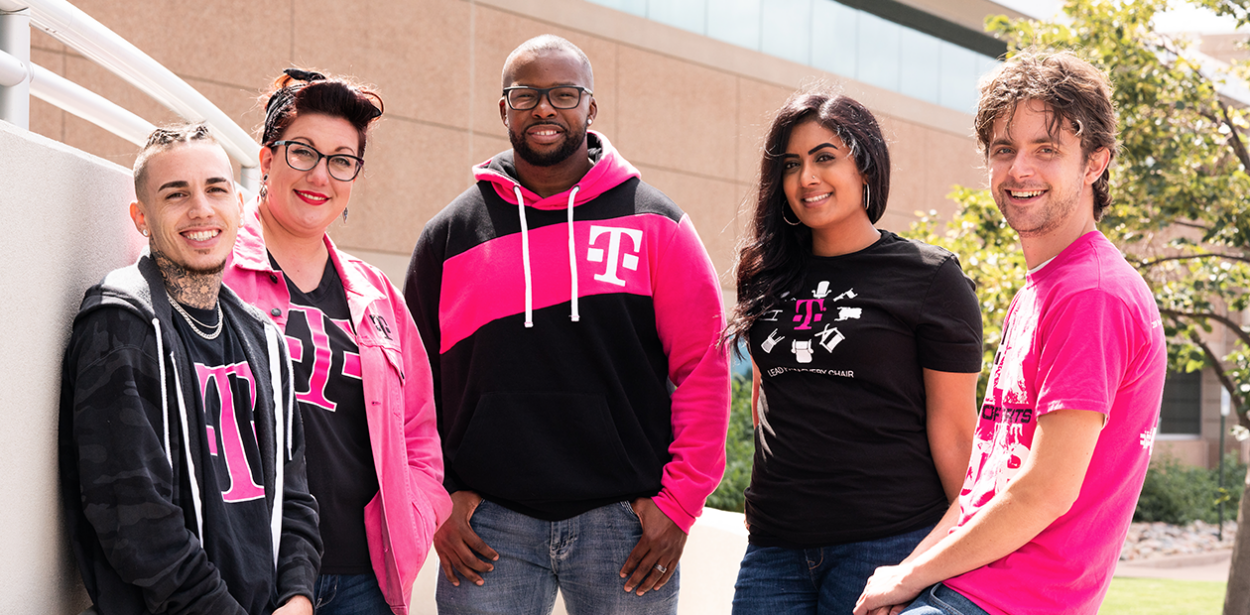 5 t-mobile employees standing together