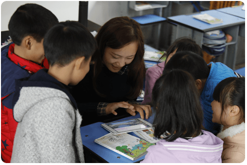 Teacher reading to student