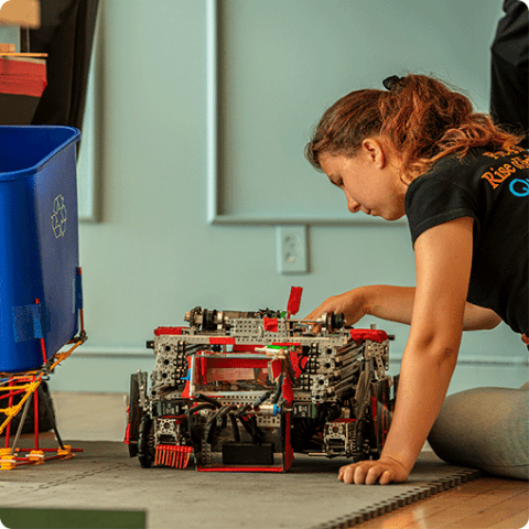 A student working on a robot project