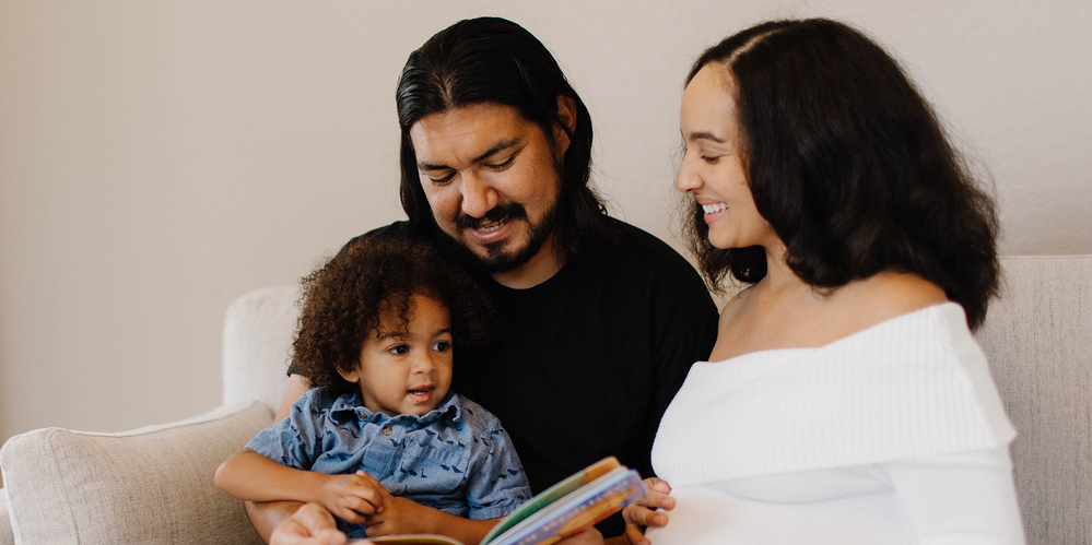 family reading a book