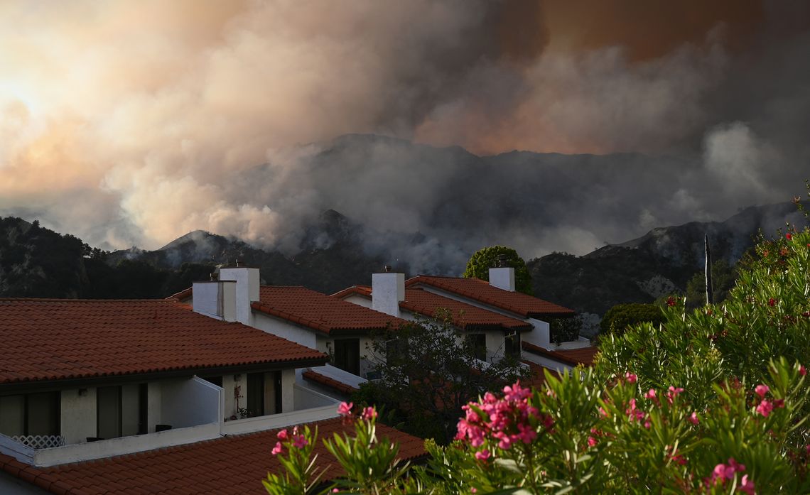 smoke from wildfires over houses