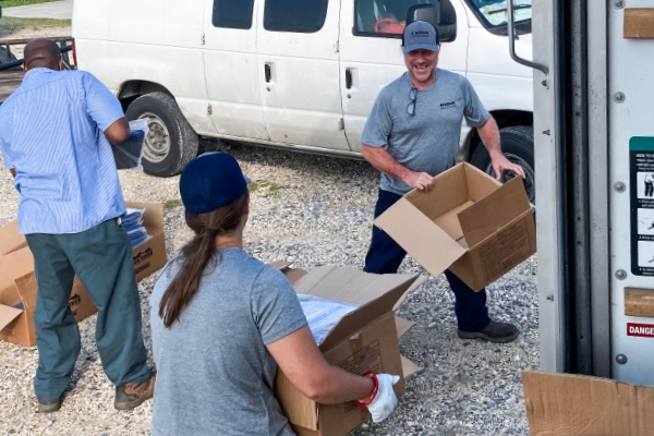 volunteers load a truck