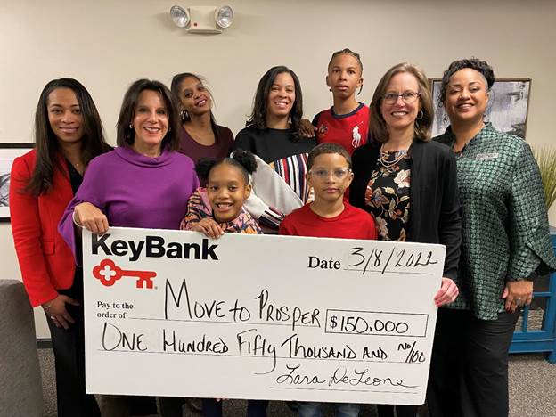KeyBank Market President Lara DeLeone (second from left), along with Corporate Responsibility Officer Kenya Taylor (far right) and SVP, Service Digitization Tracie Cleveland Thomas (far left) present a grant to Move To PROSPER President & CEO Amy Klaben (second from right) to support Empower 100 families (center).