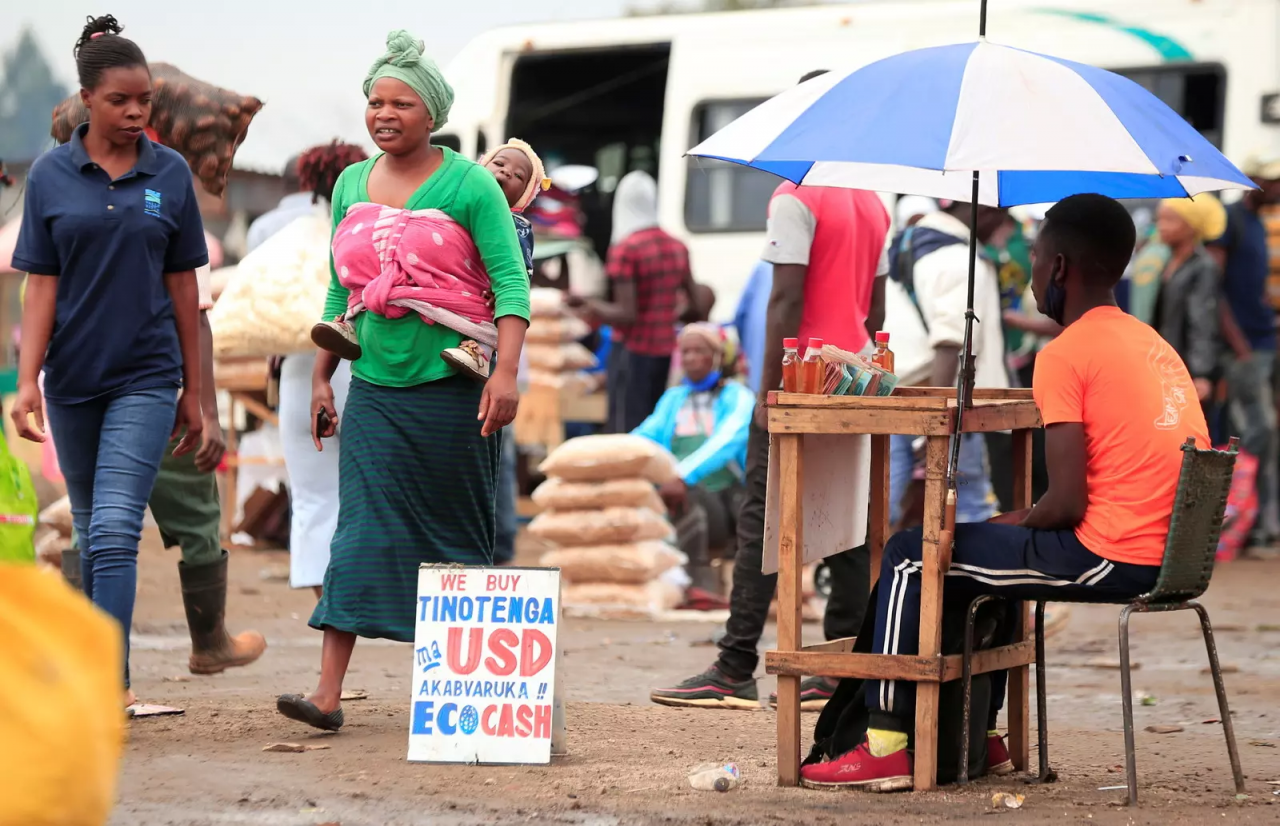 people walking in a third world country market place