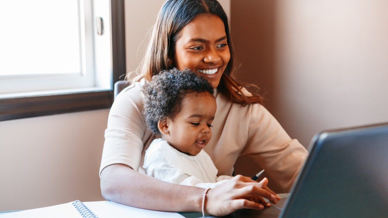 Mother and baby using laptop