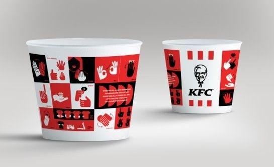 Two KFC cups with sign language on them.