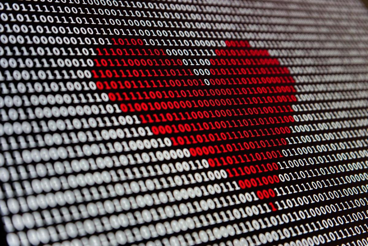 numbers on a screen with a red love heart in the middle
