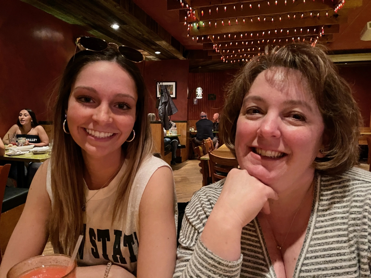 Scott's daughter and wife in a restaurant