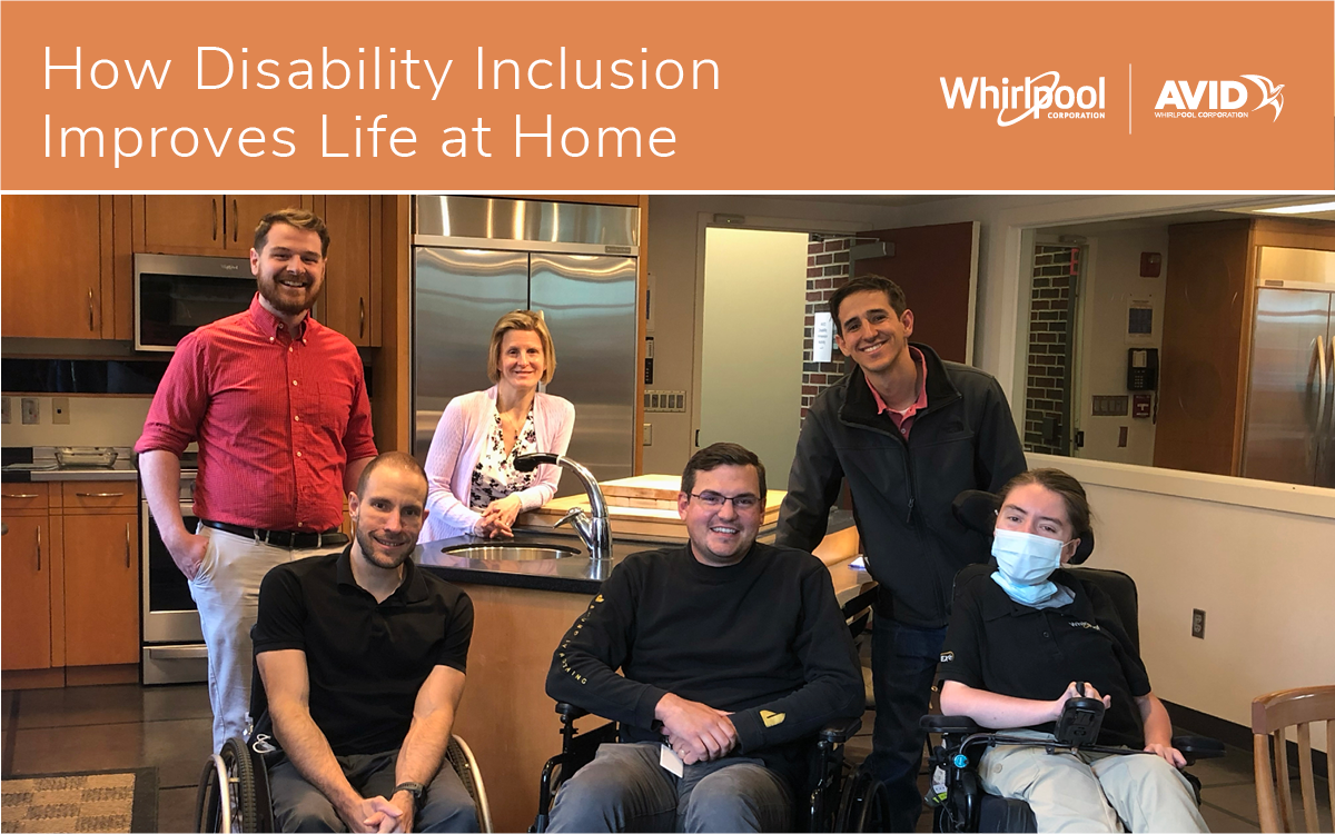 3 people stand behind 3 people in wheelchairs in a home kitchen