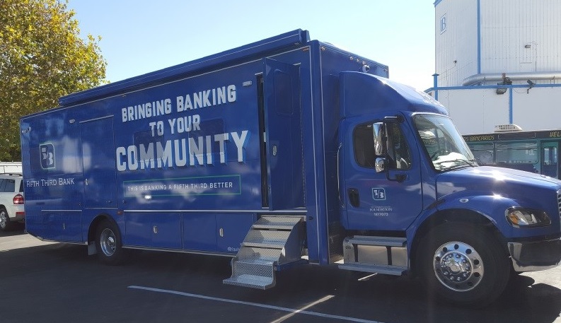 Picture of bus that says, "Bringing Banking to Your Community" on the side