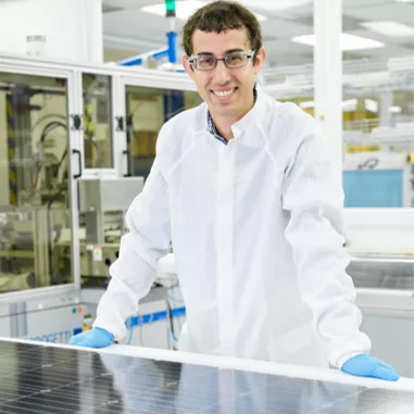 Tedlar employee with solar panel