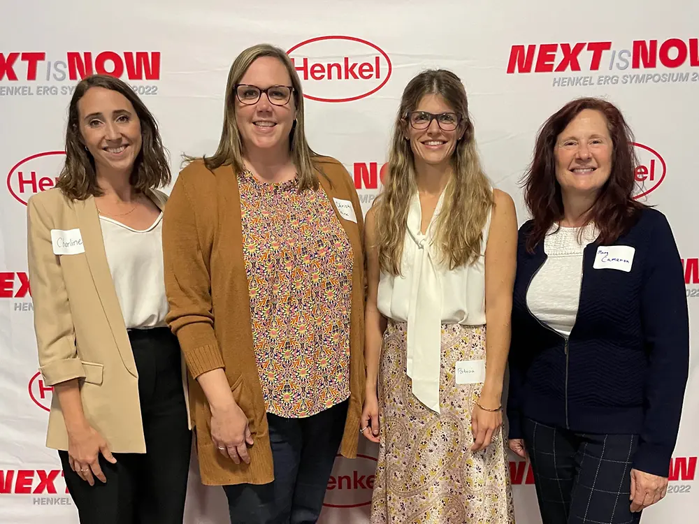 Group of women in front of Henkel logos