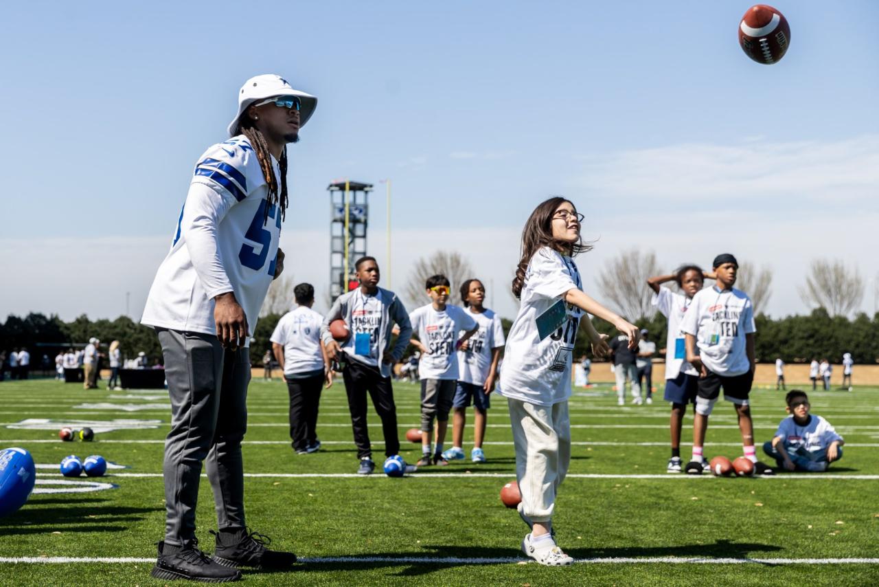 Kids playing football on Field Day
