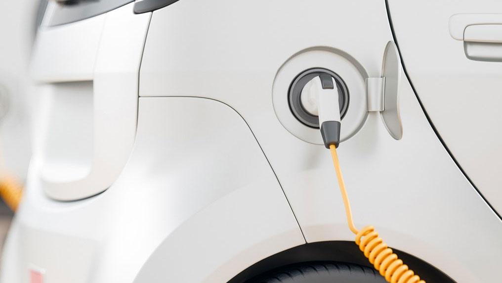 Car plugged into charging station