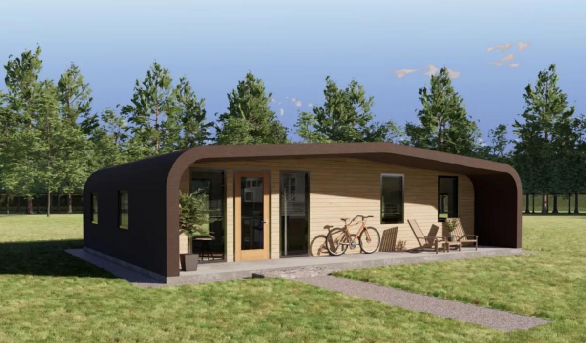 3D rendering of the exterior of the 3D printed house on a plot of land, trees in the background. A bicycle on the porch.