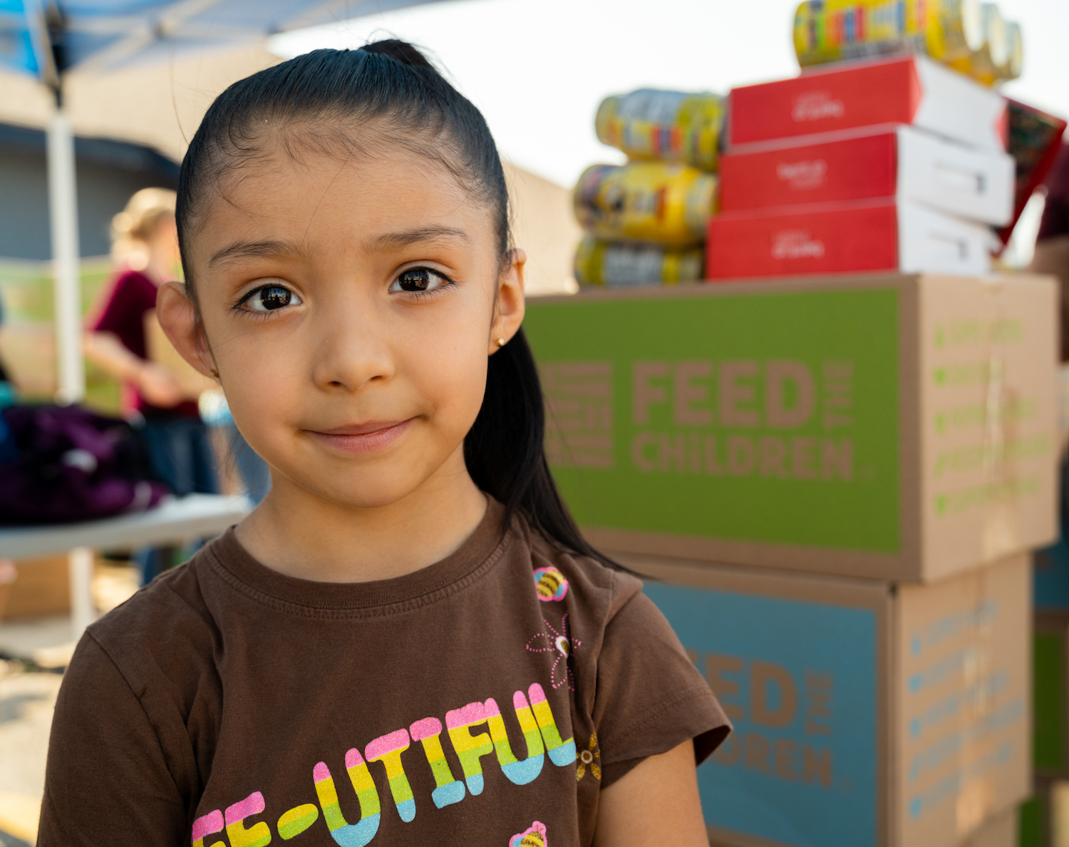 feed the children - child with nutrition boxes that fight hunger