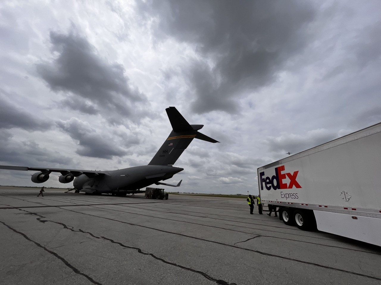 Military plane and FedEx truck