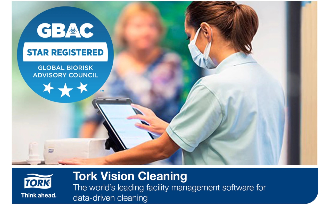 GBAC STAR registered logo and Tork Vision Cleaning banner at the bottom. A healthcare provider uses a touch screen device