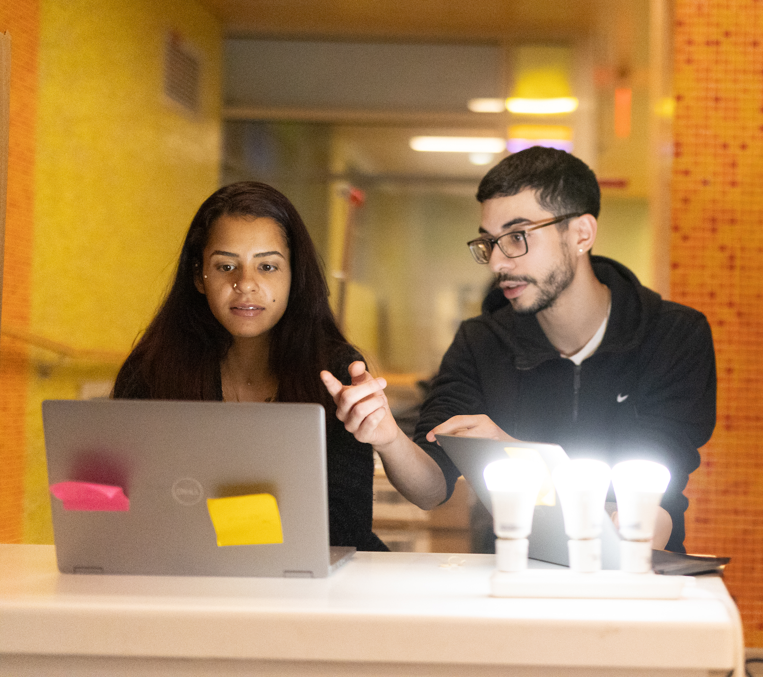 David Sepulveda and a student working with lightbulbs at Henry Street Settlement — green jobs