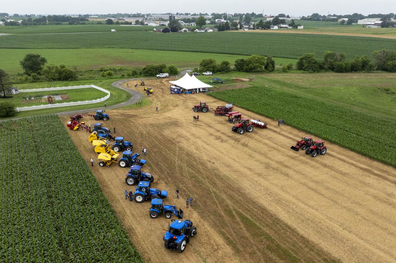 Aerial view of tractors and a tent