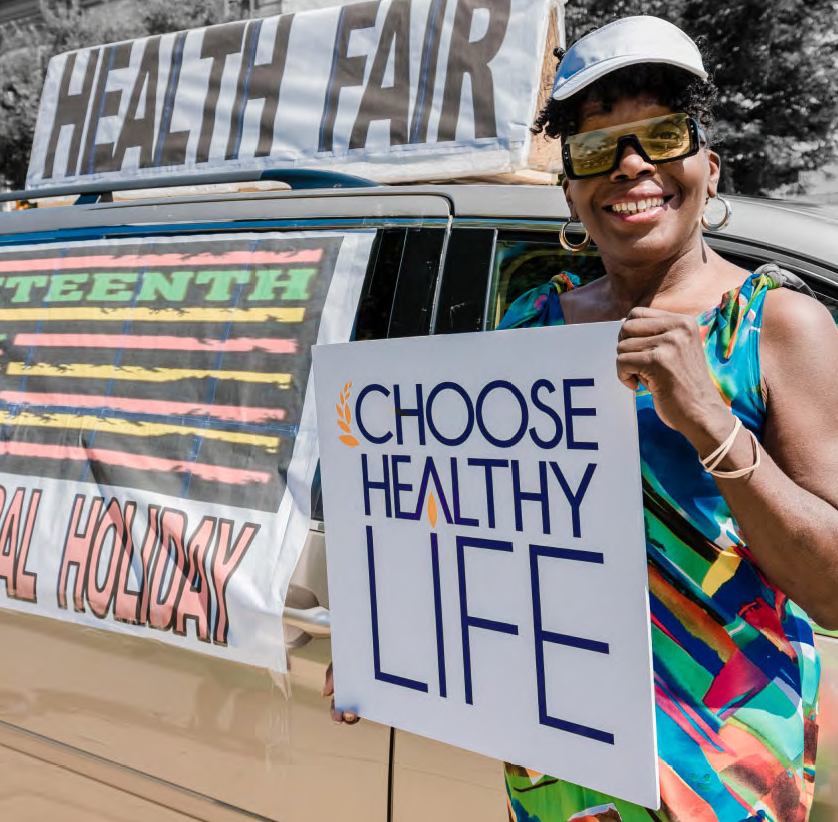 Person holding a 'Choose Healthy Life' sign