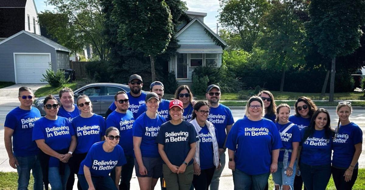 volunteers in blue Kohler t-shirts