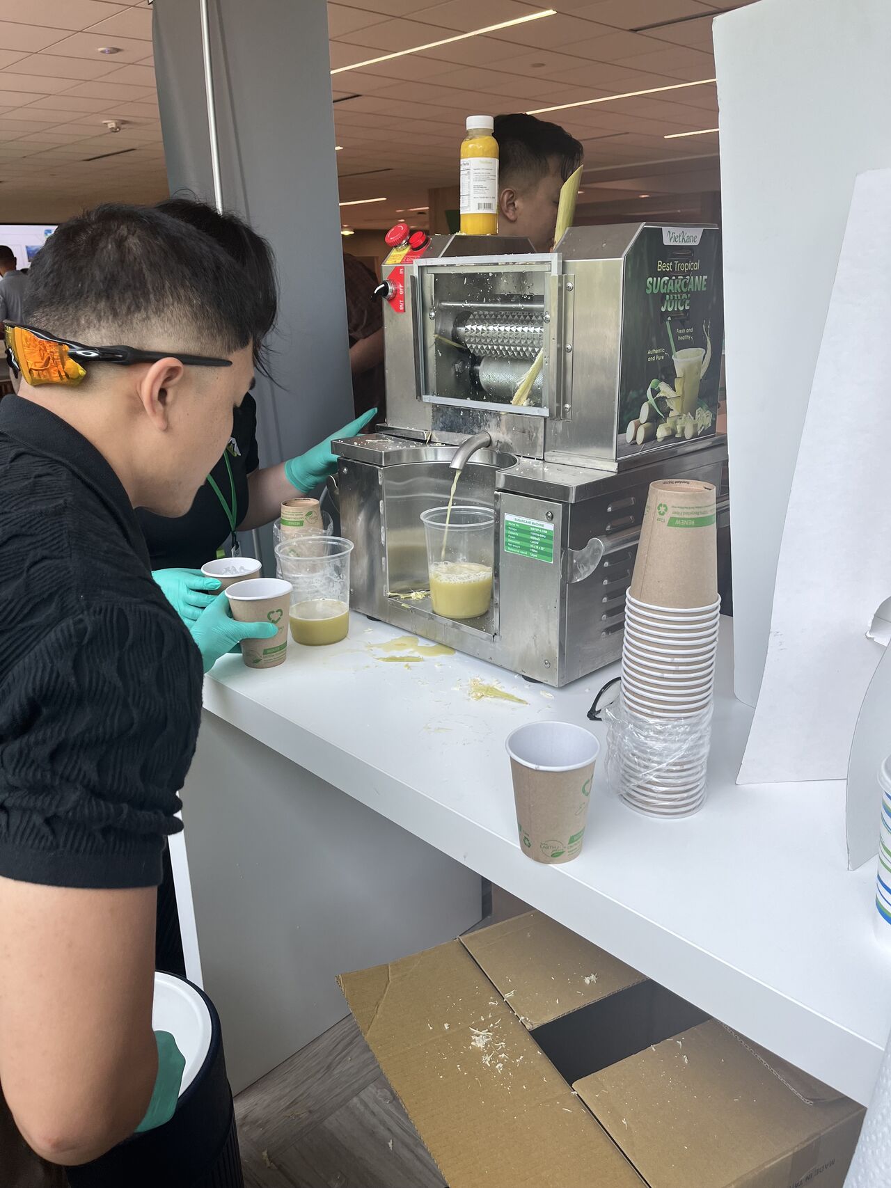 Someone watching a juice machine in action
